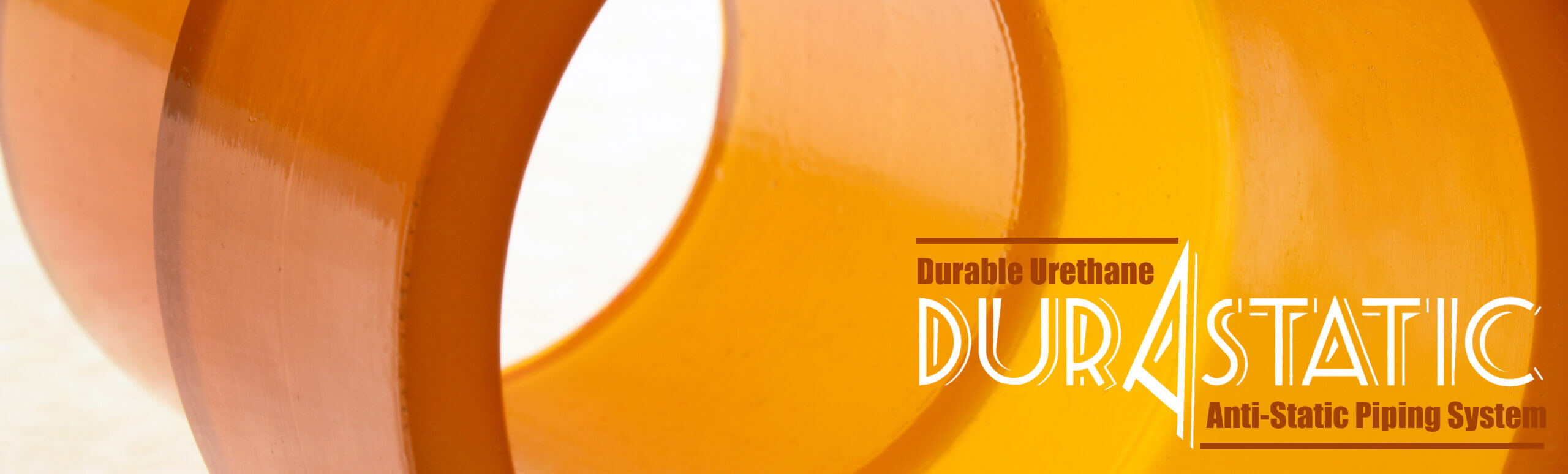 Durastatic-pipe Close-up of the inside of an orange plastic pipe with writing.